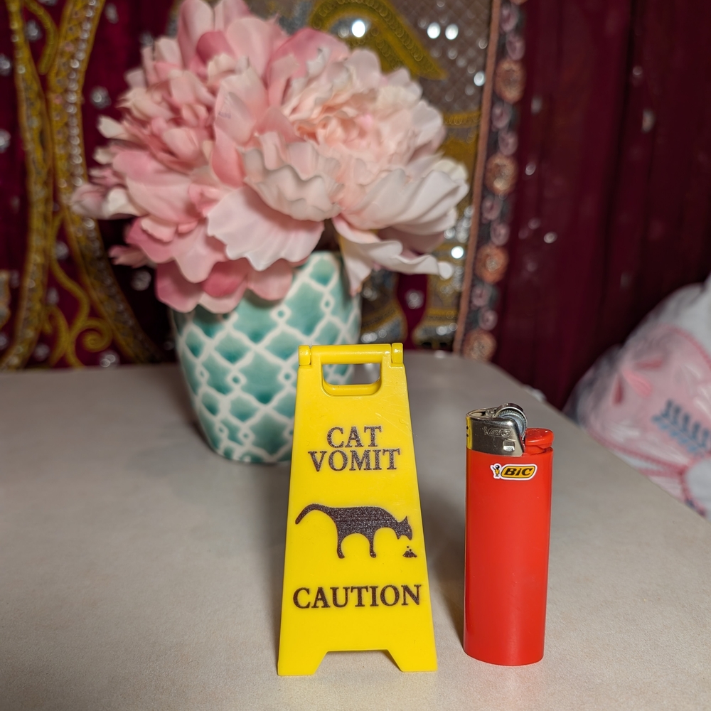 Yellow Cat Vomit Caution Sign